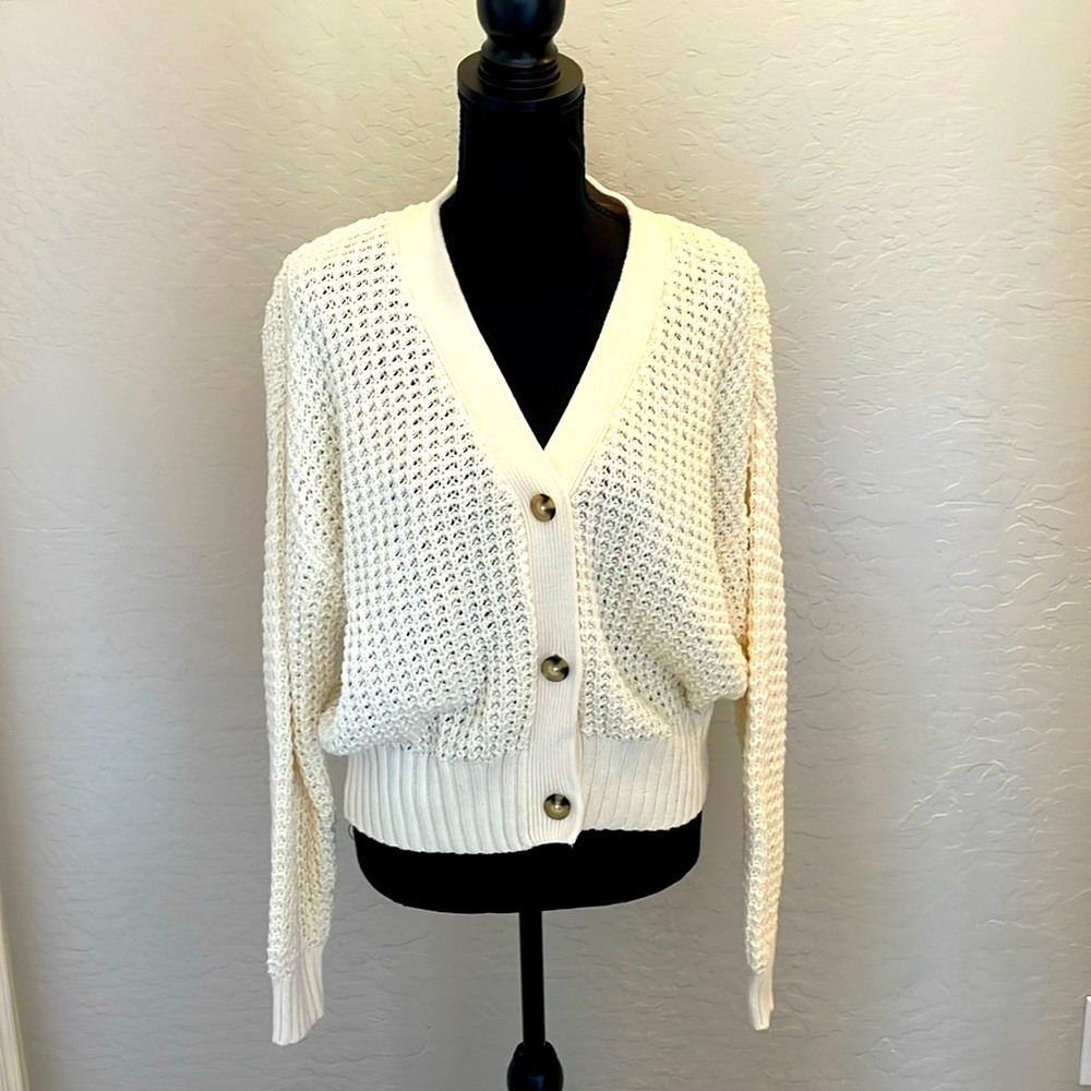 Cream sweater with tortoise buttons